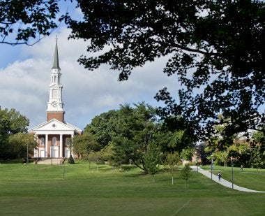 The Memorial Chapel surrounded by tree branches.