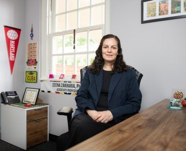 Zeena Zakharia sits in her office.