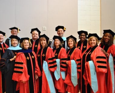 Ed.D. graduates in caps and gowns