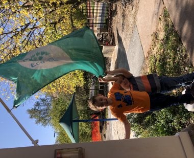 Kindergarten children with the EcoSchool USA flag