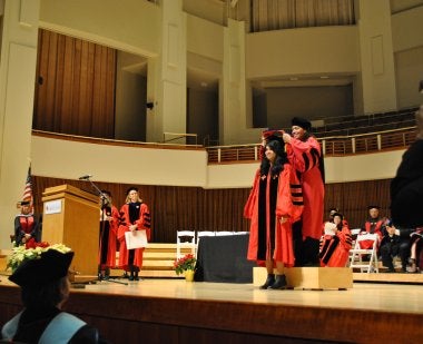 Doctoral student being hooded at Winter 2018 Commencement ceremony 