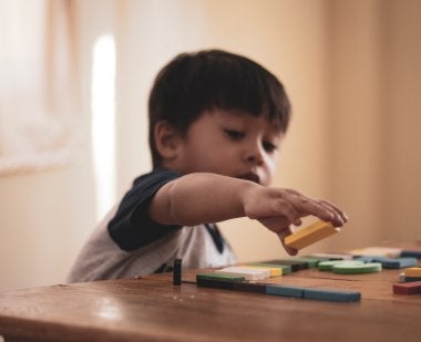 Image of child with toy blocks
