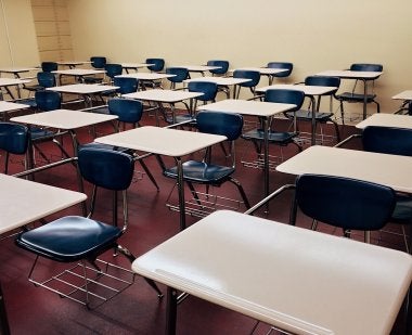 Empty Desks in Classroom Stock Photo