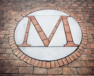 M mark on campus pavement