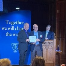 Drew Fagan accepts the 2023 Distinguished Alumni-Early Career Award from Teachers College, Columbia University.
