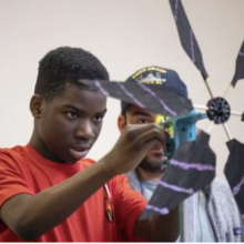 Student with windmill