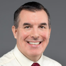 Dennis Passarella-George headshot