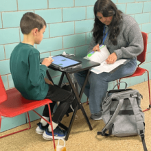 Reading with a child on an Ipad