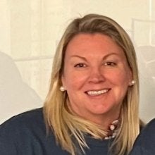 headshot of Betsy Tornquist wearing a blue TerpsEXCEED shirt