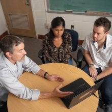 DJ Bolger and graduate students discuss research project