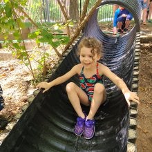 CYC Summer camp Kid on slide