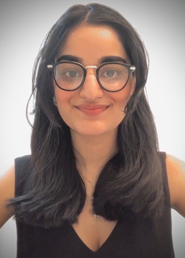 Photo of woman with long dark hair and glasses