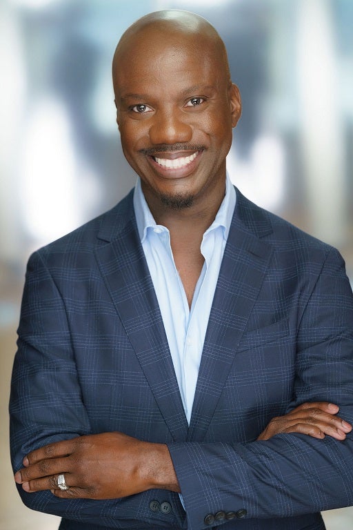 Image of Shaun Harper wearing a blue blazer and smiling