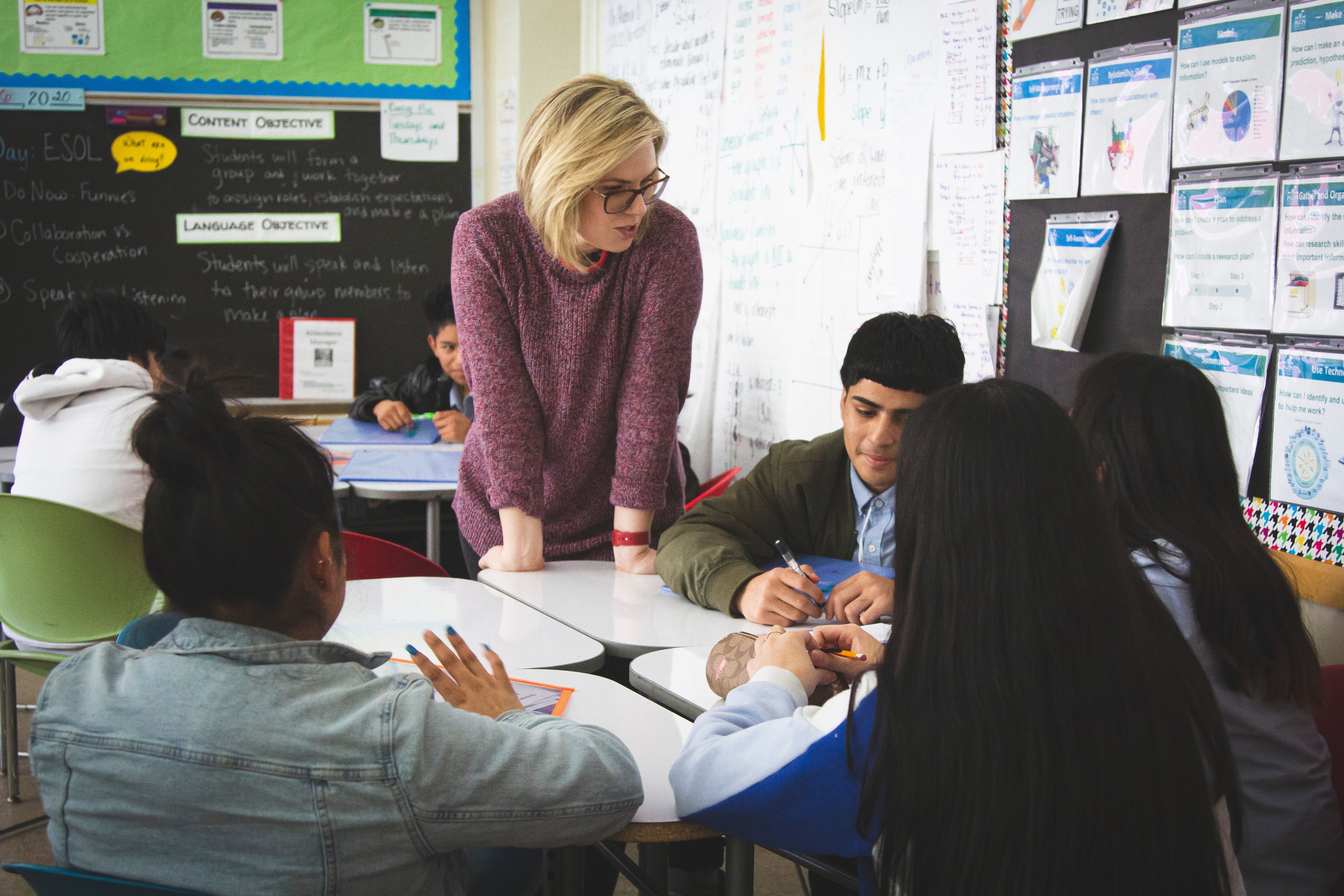 Teacher chats with students