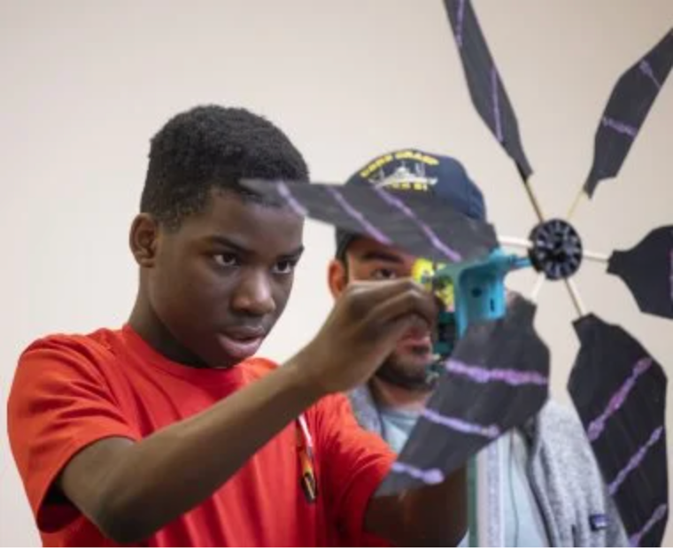 Student with windmill