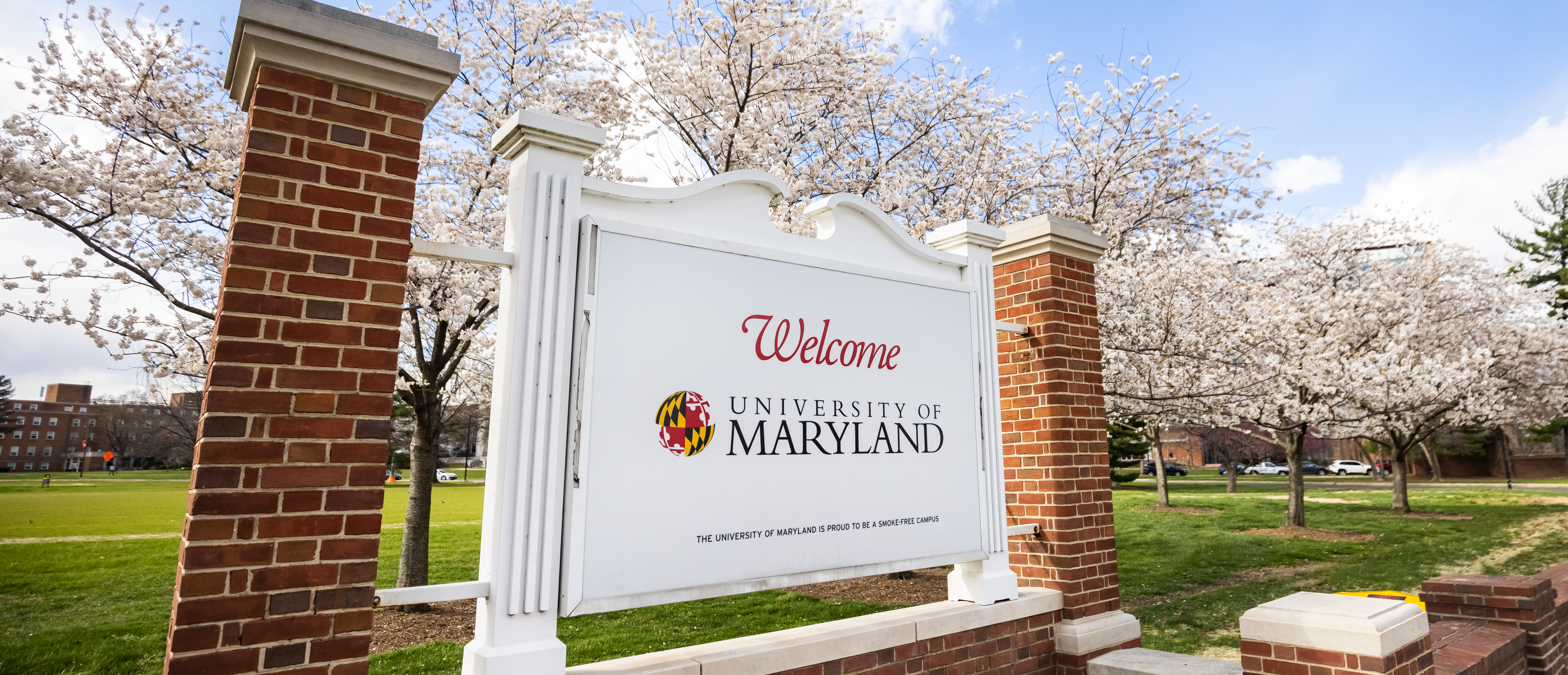 white sign that says 'welcome to the university of maryland'