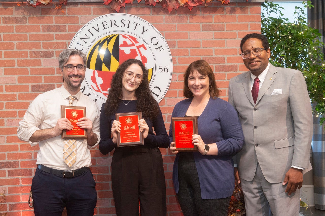 Philip Merrill Presidential Scholar Lora Abuobaid '25 (second from left) with (from left to right) teacher mentor EdTerp Avi Silber M.A. ’12, faculty mentor Kimberly Paczolt and UMD President Darryll J. Pines