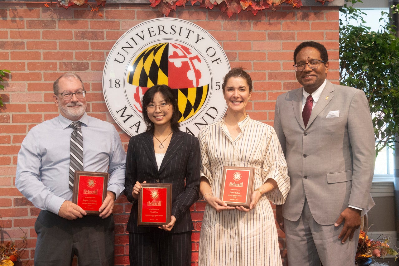 Philip Merrill Presidential Scholar Yuri Kim '25 (second from left) with (from left to right) teacher mentor EdTerp Bryan Goehring '90, faculty mentor Sarah Sohns and UMD President Darryll J. Pines