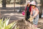 Two Young Girls Gardening