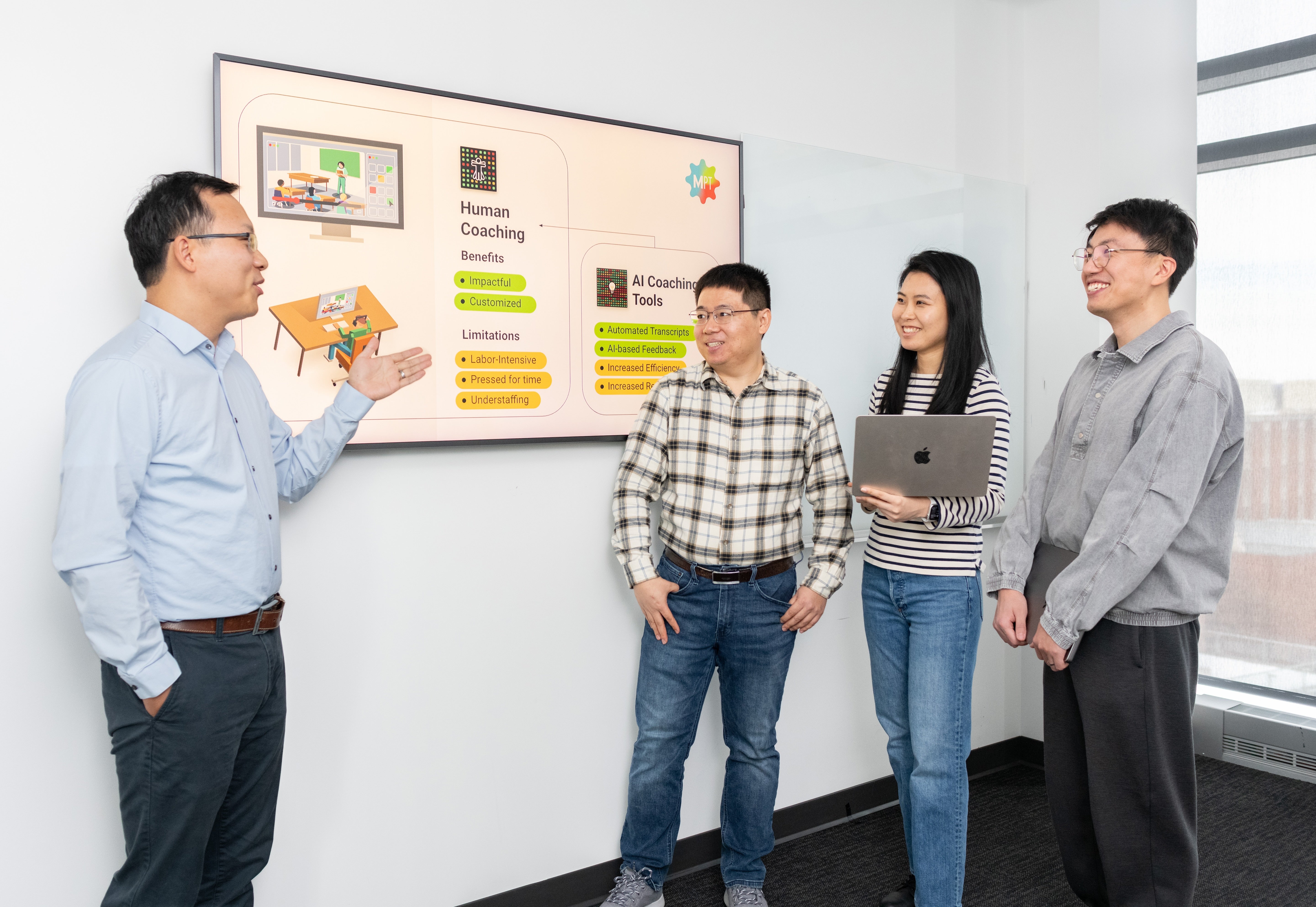 From left: Jing Liu (College of Education), Wei Ai (College of Information/UMIACS), and Ph.D. students Meiyu Li (information studies), and Paiheng Xu (computer science) discuss the use of AI to advance math education. Photo by Mike Morgan for UMIACS