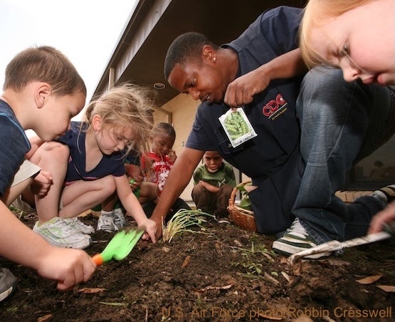 Children and educator gardening (U.S. Air Force photo, Robbin Cresswell)