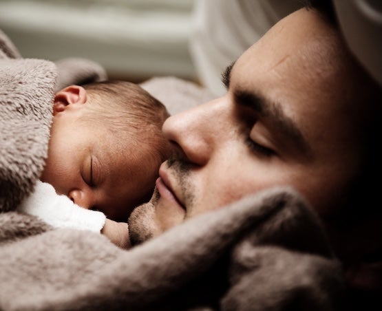 Father and baby sleeping