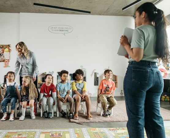 Teachers and children in classroom