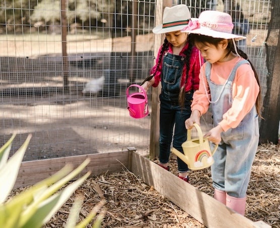 Two girls gardening