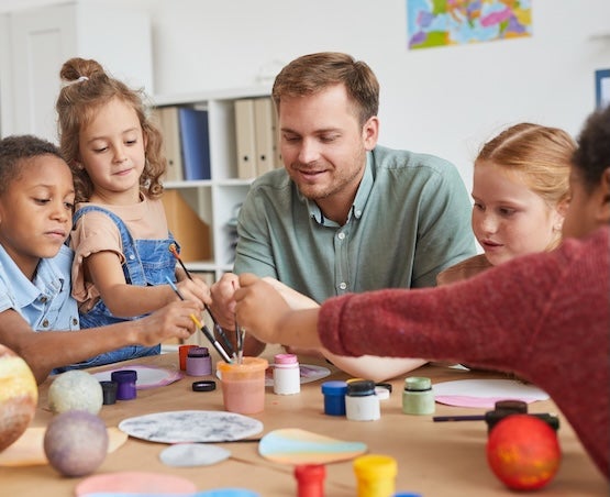 Man and Children Painting