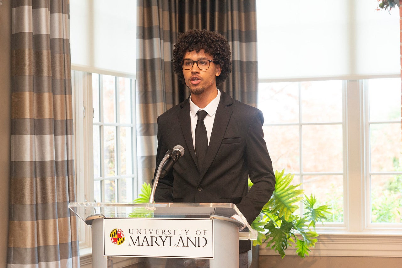 Roman Lakner speaks at a podium at the Philip Merrill Presidential Scholars ceremony