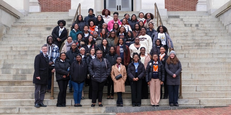 MILE students and faculty stand on the front steps of the Maryland State House