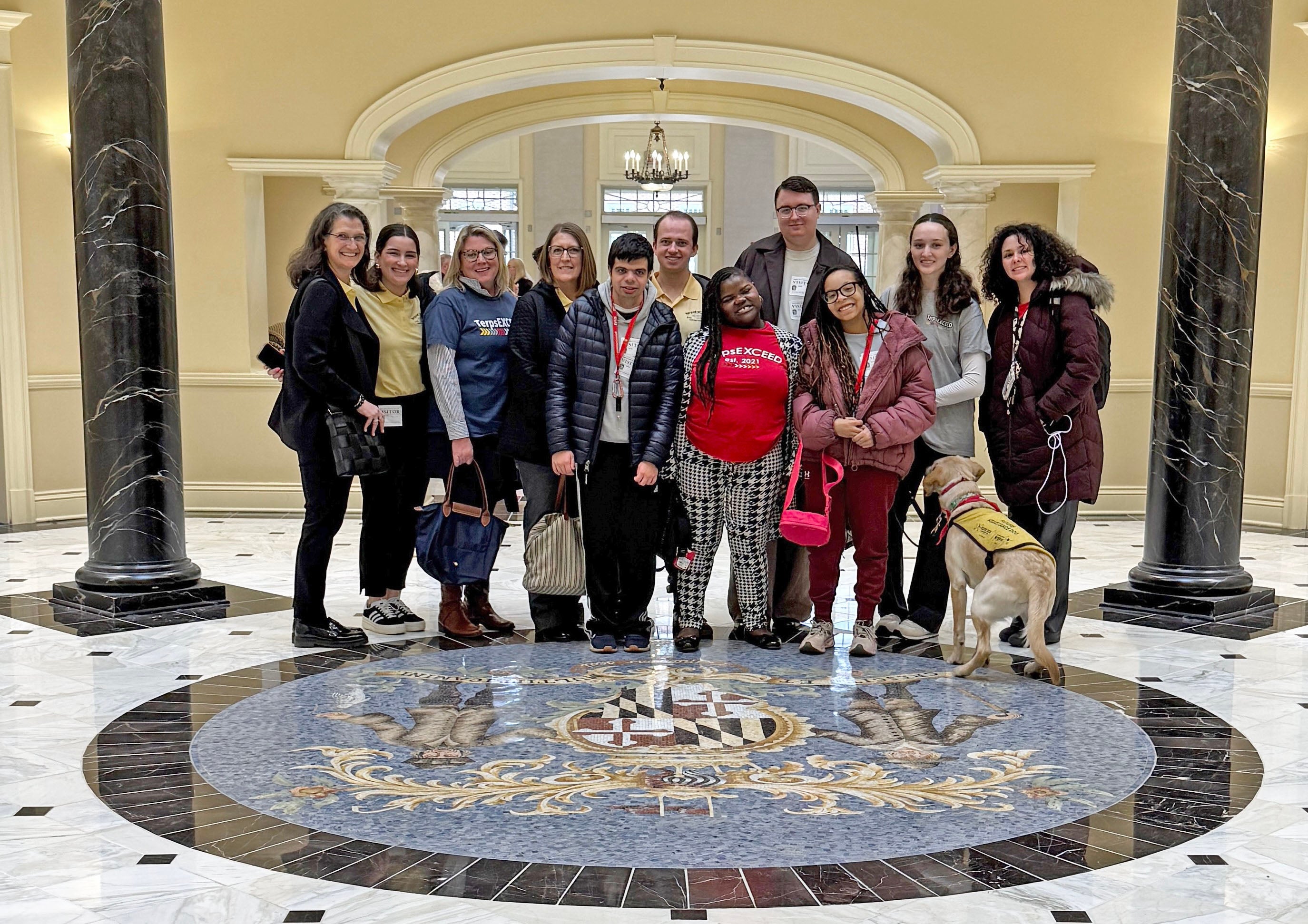 TerpsEXCEED students, graduates, peer mentors and faculty stand inside the State House during their trip to Annapolis in 2026 to advocate for funding for the program.