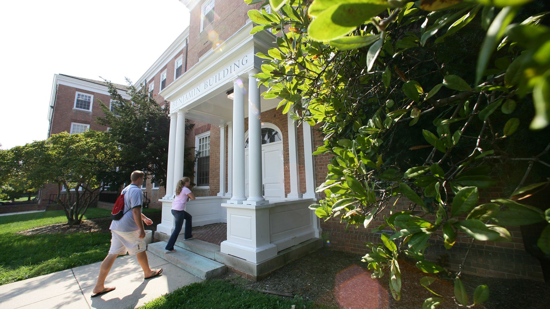 Benjamin Building with students walking in the entrance