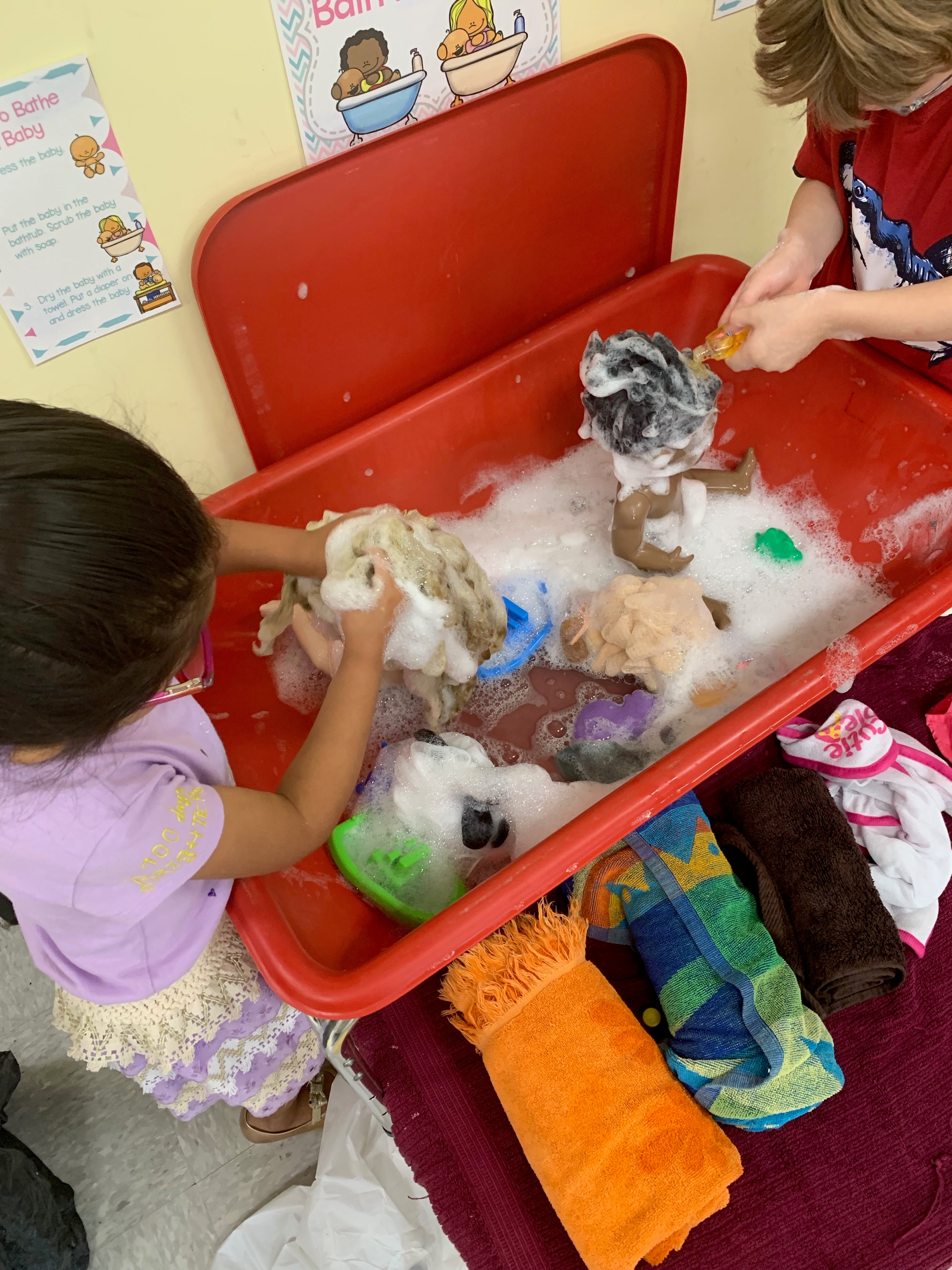 Children washing babies