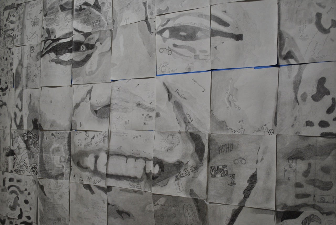 Arts integration mural of a boy's face showing detail in drawing
