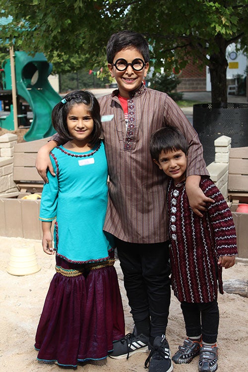 Three children in ethnic clothing